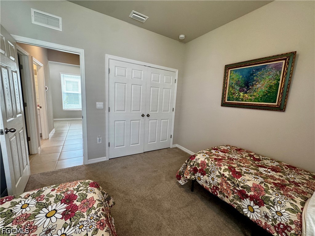 882 Friendship Circle LaBelle, FL 33935 - Photo 28 of 37 a bedroom with bed and window