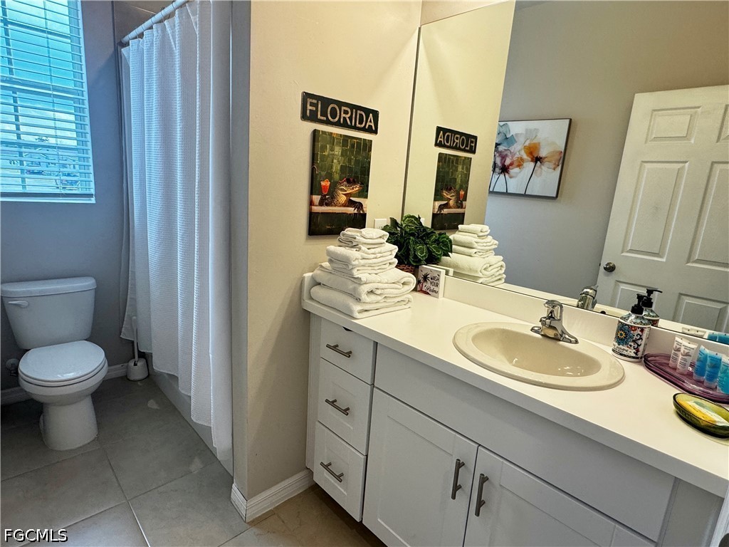 882 Friendship Circle LaBelle, FL 33935 - Photo 29 of 37 a bathroom with a toilet sink and mirror