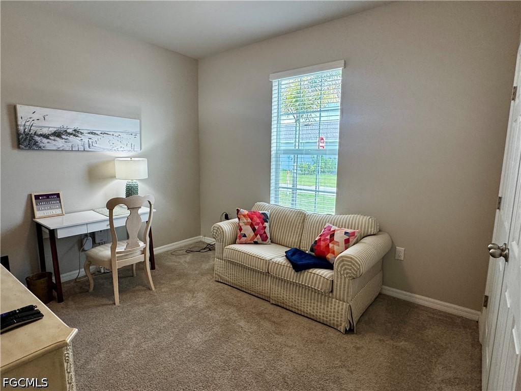 882 Friendship Circle LaBelle, FL 33935 - Photo 30 of 37 a living room with furniture and a window