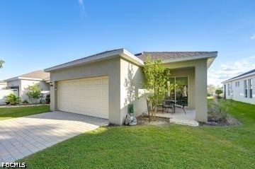 882 Friendship Circle LaBelle, FL 33935 - Photo 37 of 37 a view of a house with backyard and garden