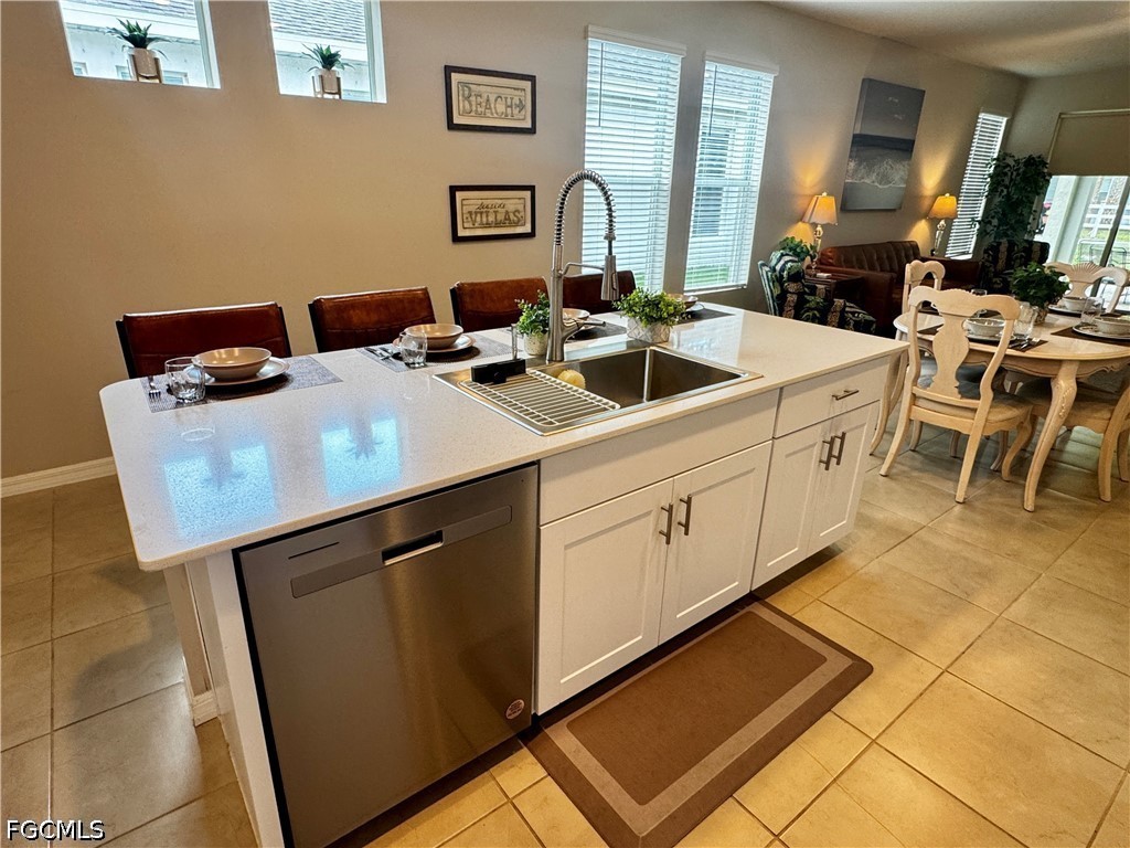 882 Friendship Circle LaBelle, FL 33935 - Photo 9 of 37 a kitchen with a sink cabinets and counter space