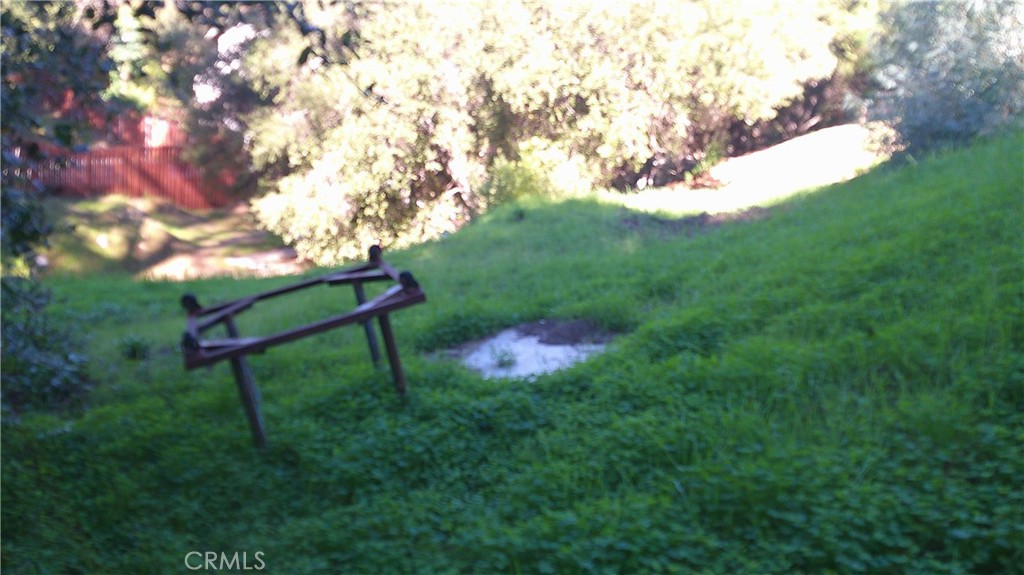 4214 Elzevir Road Woodland Hills, CA 91364 - Photo 7 of 14 a backyard of a house with table and chairs