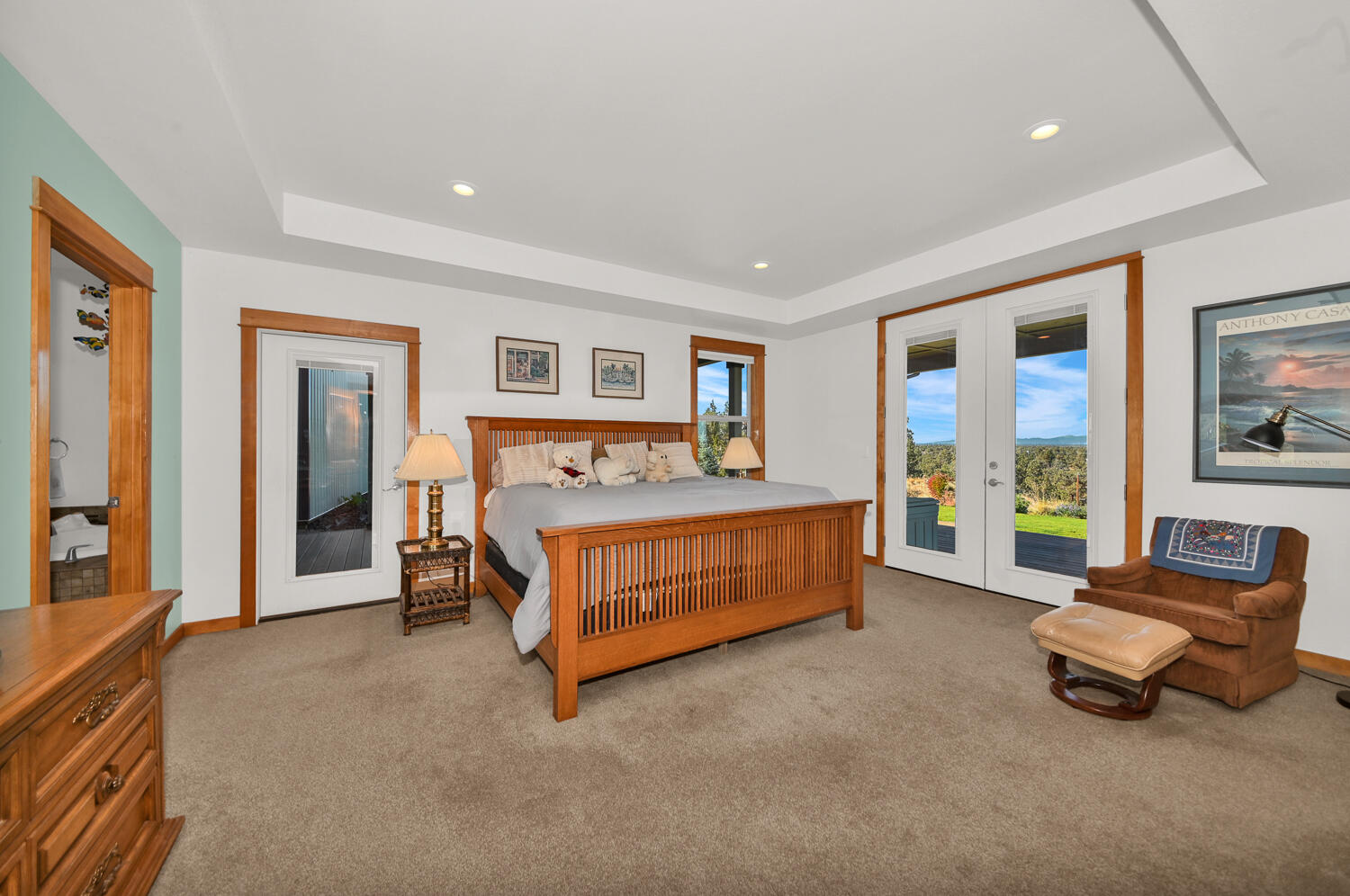 62860 Deschutes Road Bend, OR 97701 - Photo 19 of 34 Large main bedroom with recessed ceiling accent, walk-in closet and French doors plus another side door leading out to the Hot Tub and Deck area