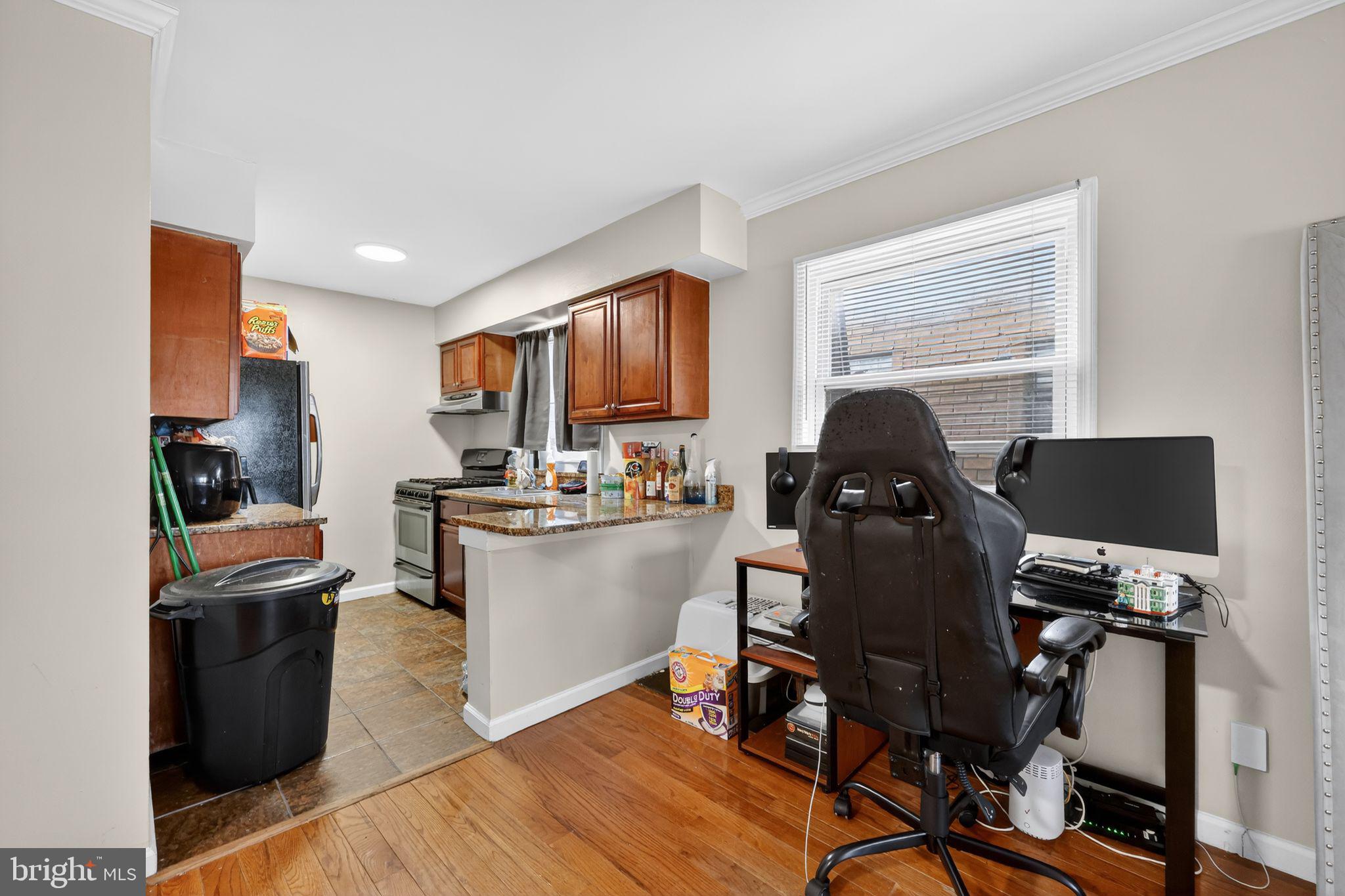 2406 Township Line Road Havertown, PA 19083 - Photo 5 of 15 a work room with furniture a rug and a window