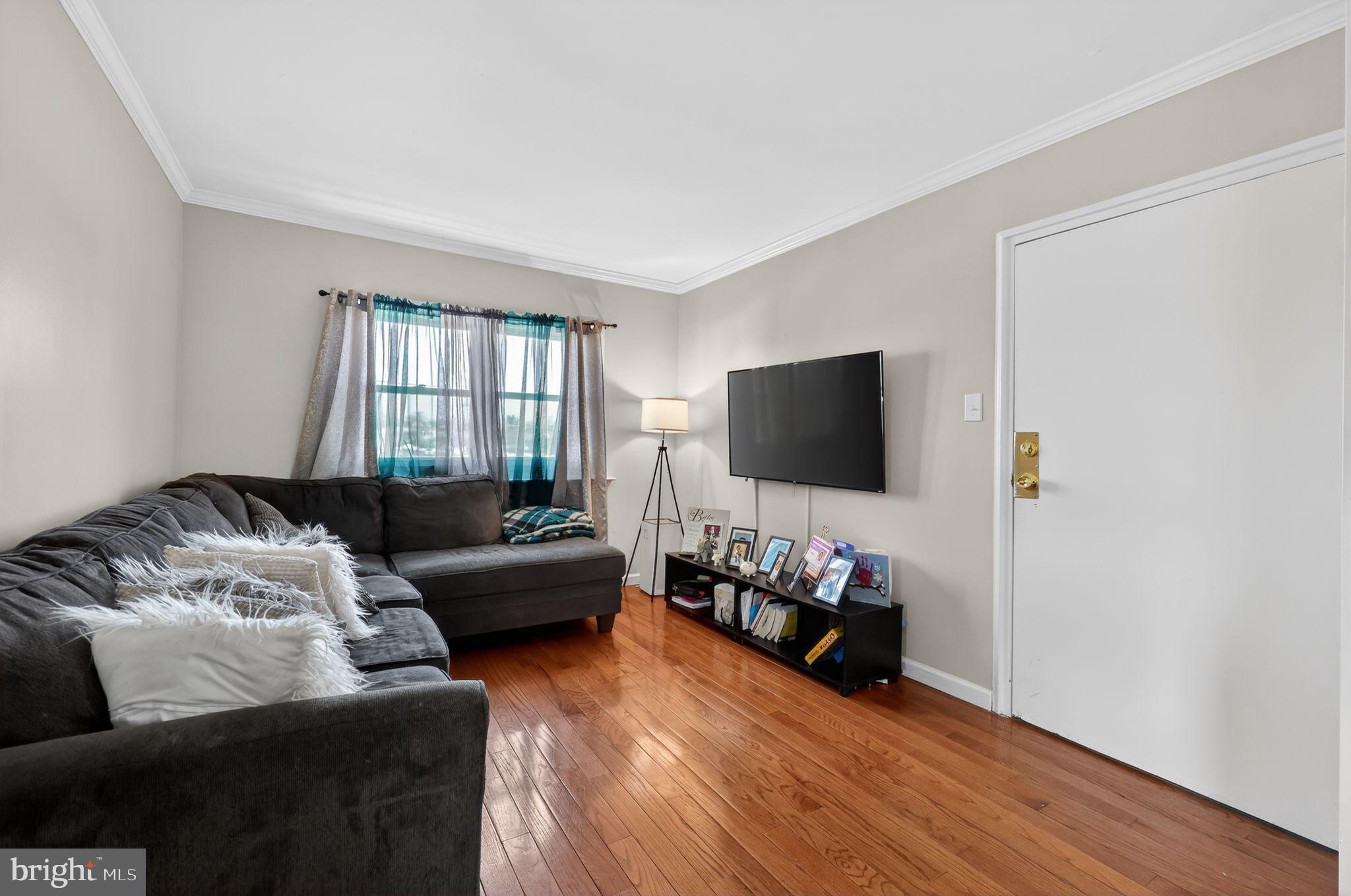 2406 Township Line Road Havertown, PA 19083 - Photo 8 of 15 a living room with furniture and a flat screen tv