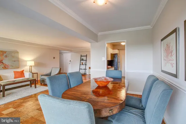a living room with furniture and a lamp
