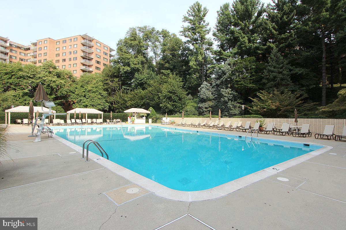 4201 Cathedral Avenue Northwest, Unit 1223E Washington, DC 20016 - Photo 19 of 26 a view of a swimming pool with a terrace