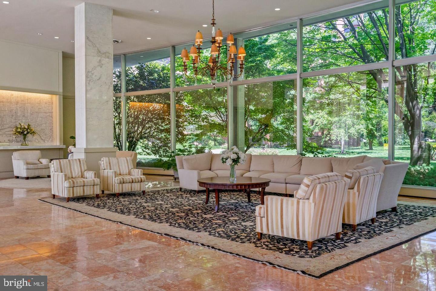 4201 Cathedral Avenue Northwest, Unit 1223E Washington, DC 20016 - Photo 25 of 26 a living room with furniture and a large window