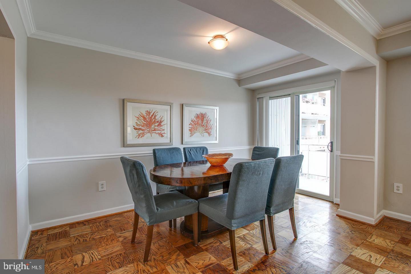 4201 Cathedral Avenue Northwest, Unit 1223E Washington, DC 20016 - Photo 3 of 26 a view of a dining room with furniture and wooden floor
