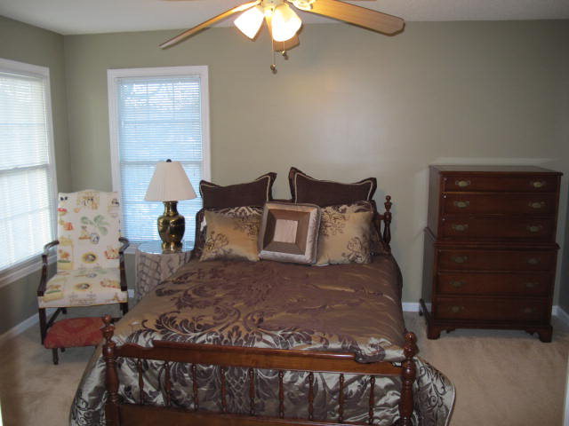 121 Lake Pointe Drive Macon, GA 31210 - Photo 9 of 14 a bed sitting in a bedroom next to a window and dresser