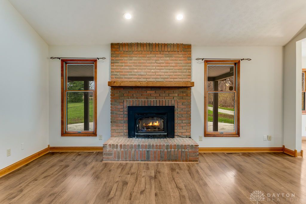 7400 Cook-Jones Road Waynesville, OH 45068 - Photo 33 of 72 This inviting living space features a cozy fireplace, perfect for tranquil evenings at home.