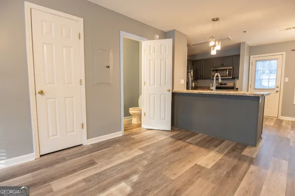 a view of a kitchen cabinets and wooden floor