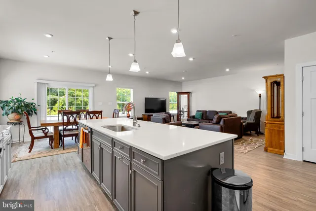 a view of a livingroom with workspace and a couch