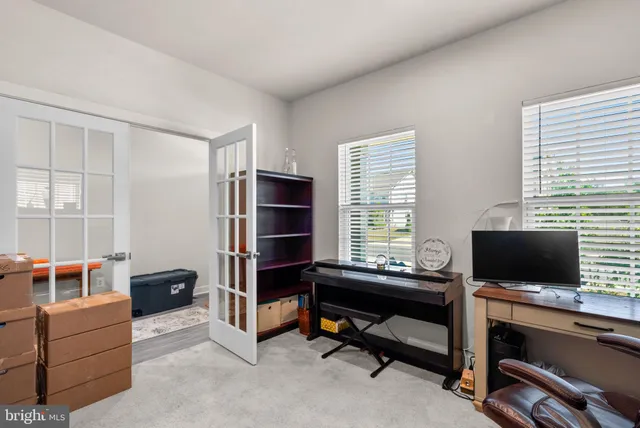 a living room with a couch and a window