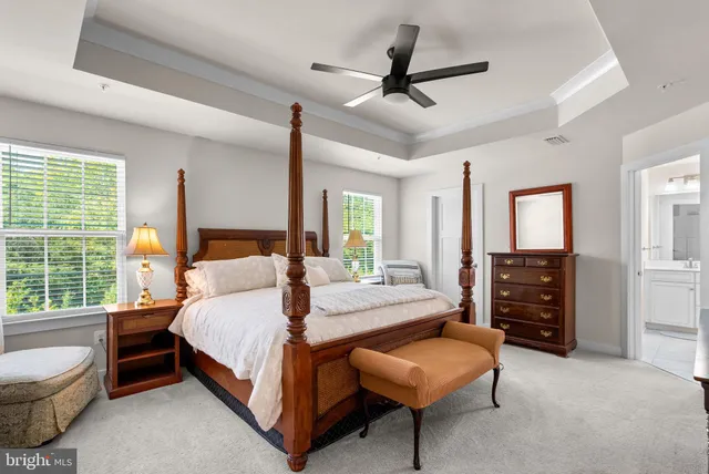 a spacious bathroom with double sink and a mirror