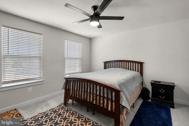 a bathroom with a sink a toilet and shower curtain