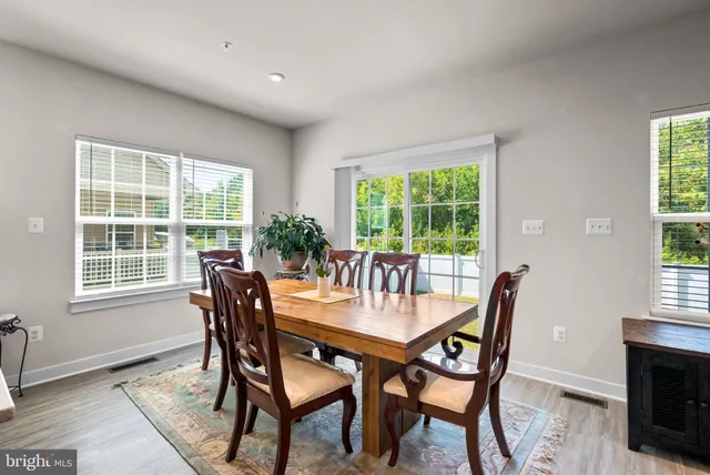 a large kitchen with stainless steel appliances kitchen island a large island in the center