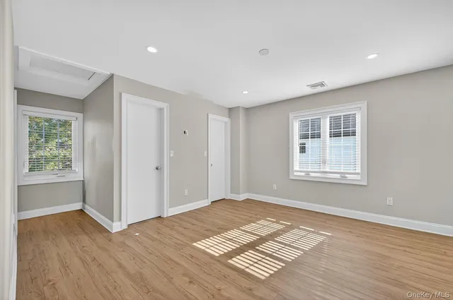 a bathroom with a double vanity sink toilet and shower