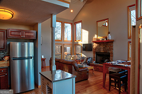 1322 Hunter Drive Ranger, GA 30734 - Photo 12 of 38 a living room with furniture a fireplace and a dining table with wooden floor