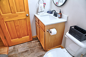 1322 Hunter Drive Ranger, GA 30734 - Photo 19 of 38 a bathroom with a sink a toilet and mirror