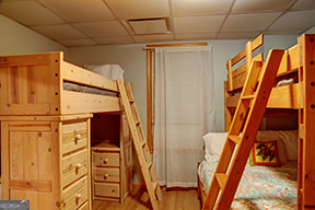 1322 Hunter Drive Ranger, GA 30734 - Photo 22 of 38 a view of an empty room with wooden floor and furniture
