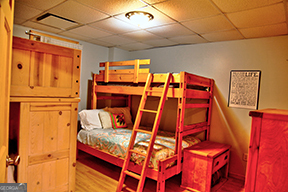 1322 Hunter Drive Ranger, GA 30734 - Photo 23 of 38 a bedroom with a bed and wooden floor