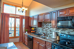 1322 Hunter Drive Ranger, GA 30734 - Photo 27 of 38 a kitchen with stainless steel appliances granite countertop a stove sink and cabinets