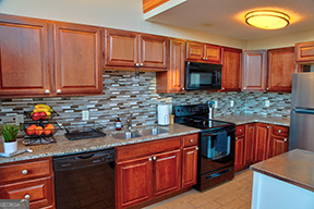 1322 Hunter Drive Ranger, GA 30734 - Photo 28 of 38 a kitchen with stainless steel appliances granite countertop a sink stove and cabinets