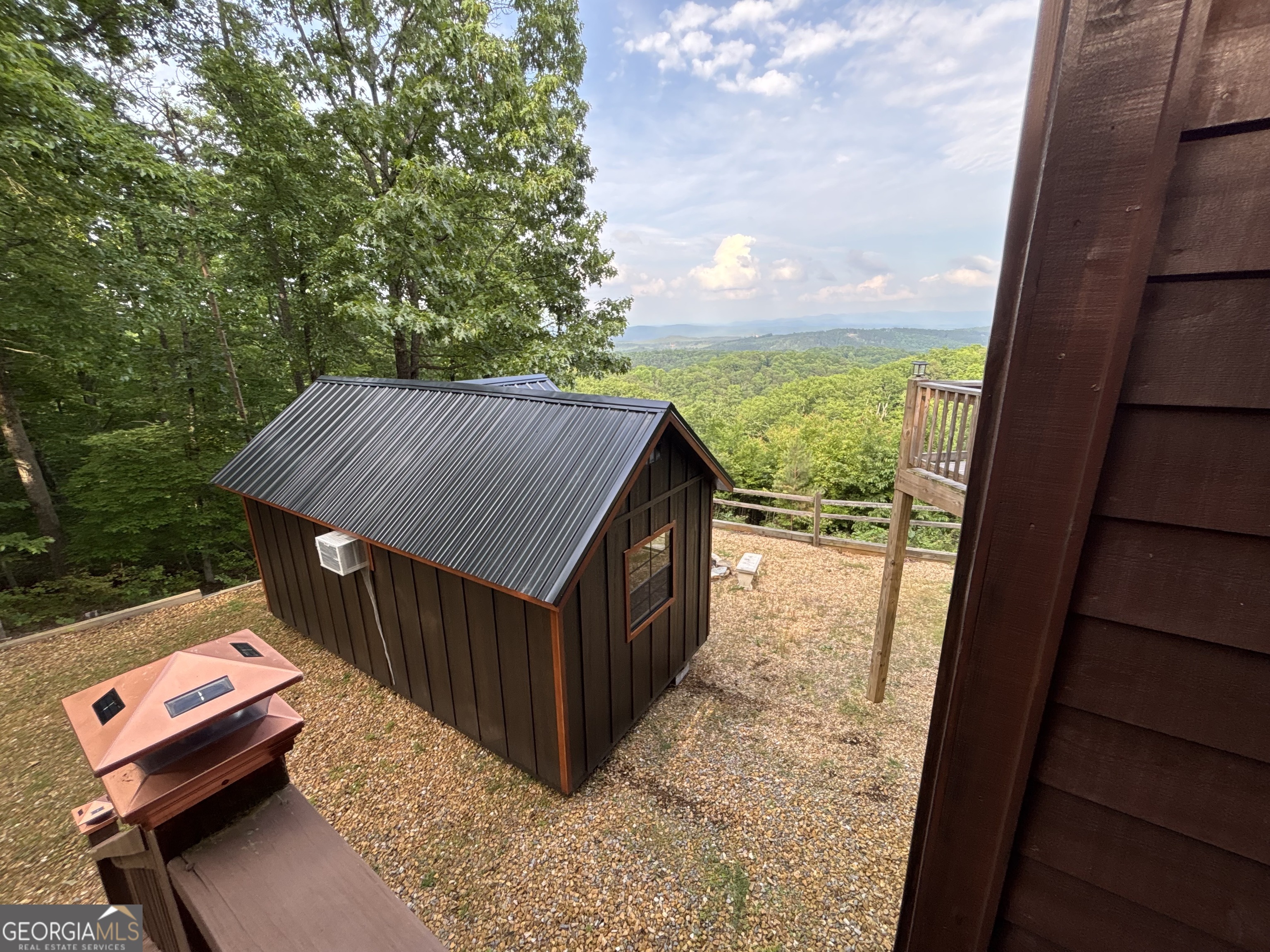 1322 Hunter Drive Ranger, GA 30734 - Photo 6 of 38 a balcony with wooden floor and outdoor space