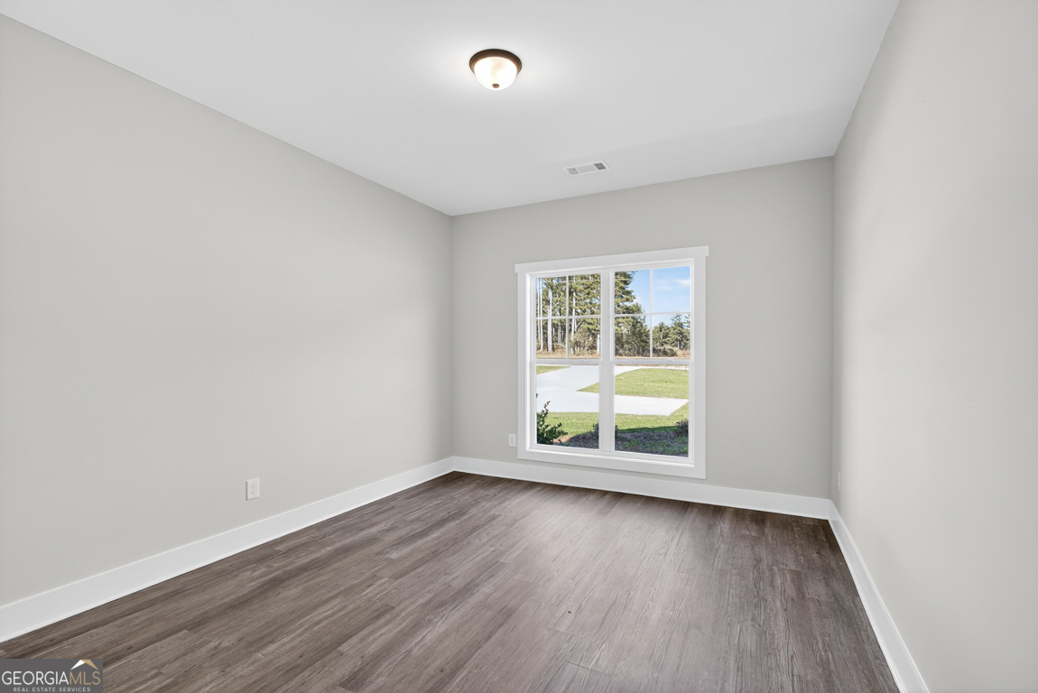 2577 Bethany Bowersville Road, Unit 7 Canon, GA 30520 - Photo 22 of 45 an empty room with wooden floor and window