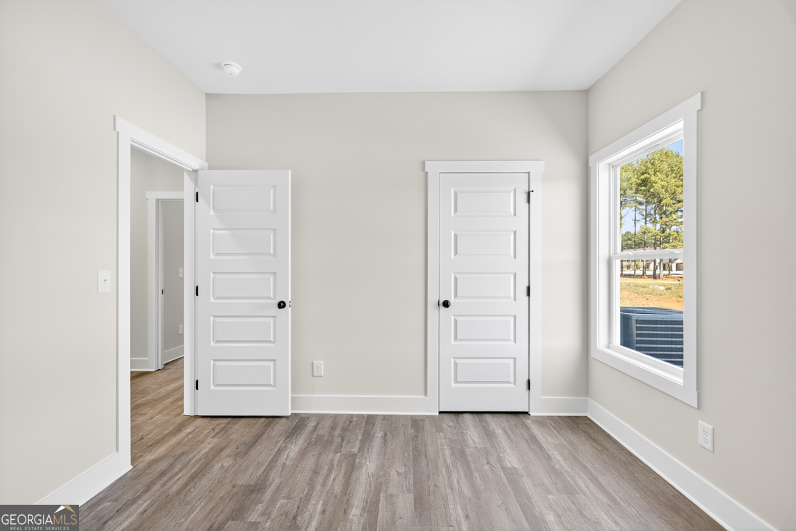 2577 Bethany Bowersville Road, Unit 7 Canon, GA 30520 - Photo 29 of 45 an empty room with windows and closet