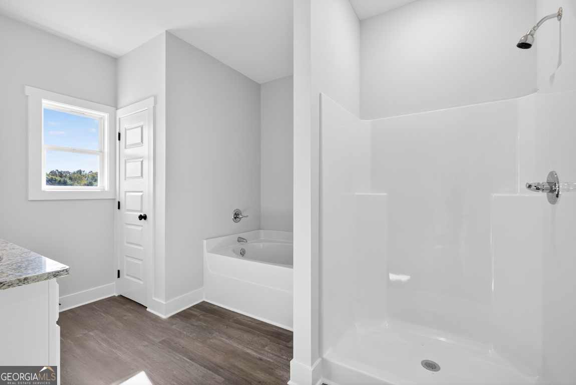 2577 Bethany Bowersville Road, Unit 7 Canon, GA 30520 - Photo 34 of 45 a bathroom with a bathtub and a shower