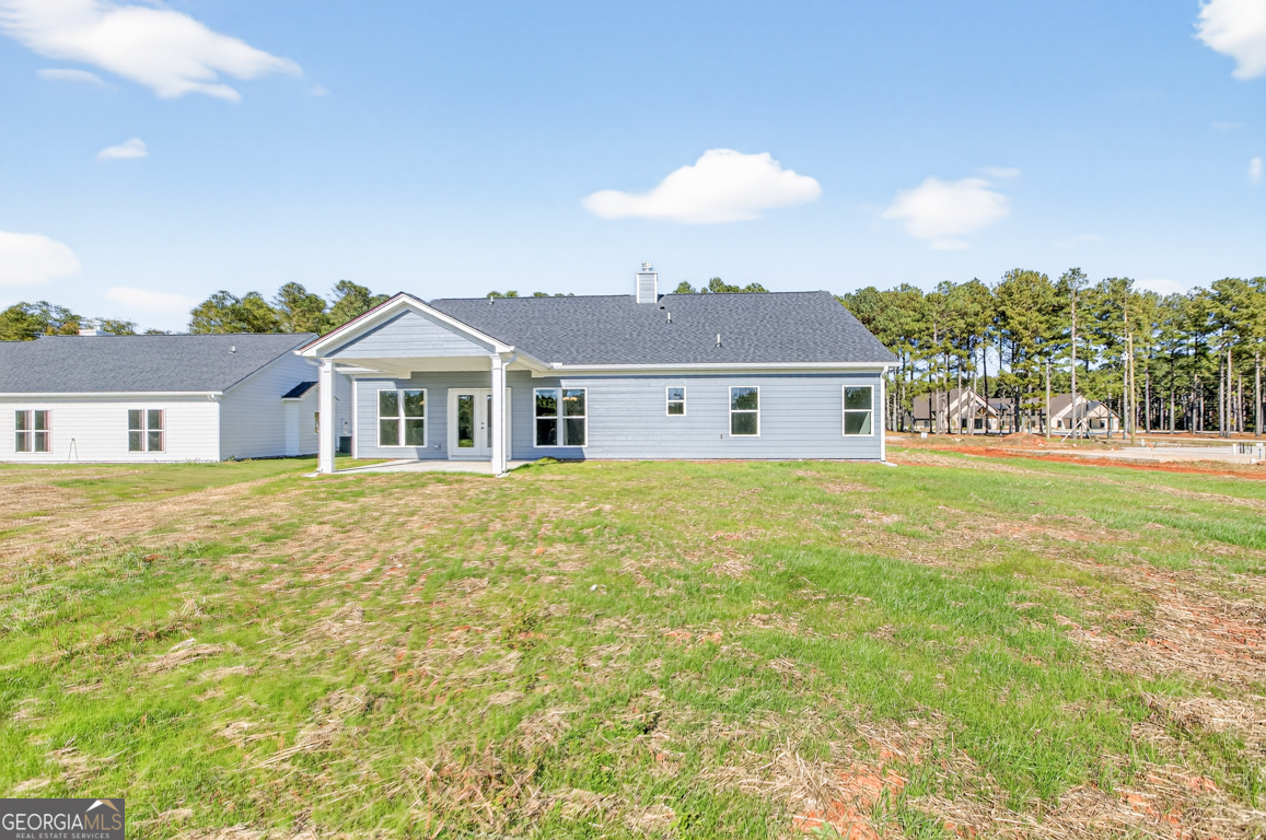 2577 Bethany Bowersville Road, Unit 7 Canon, GA 30520 - Photo 44 of 45 a front view of a house with a garden