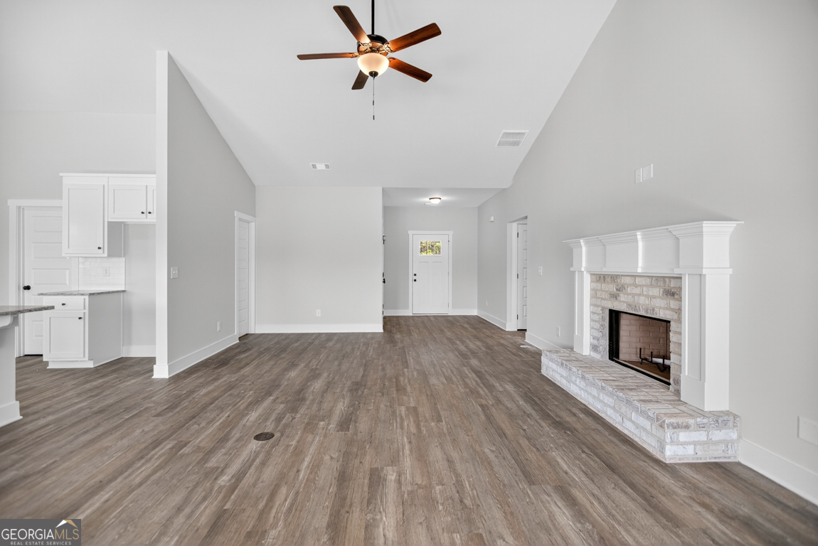 2577 Bethany Bowersville Road, Unit 7 Canon, GA 30520 - Photo 6 of 45 a view of empty room with wooden floor and fireplace
