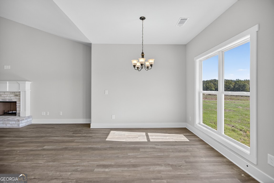 2577 Bethany Bowersville Road, Unit 7 Canon, GA 30520 - Photo 10 of 45 a view of a room with wooden floor chandelier and windows