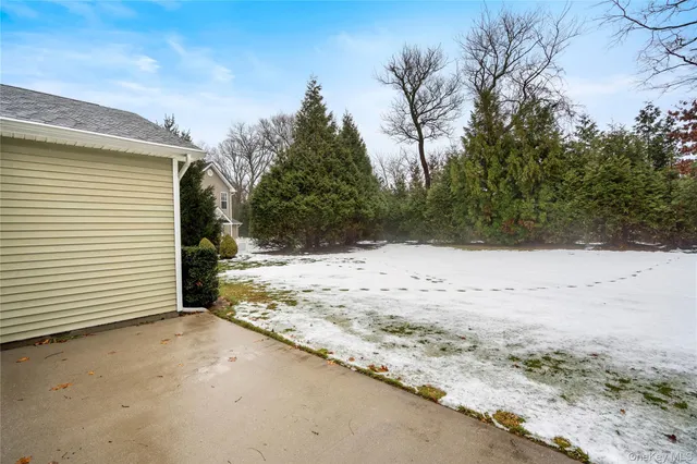a view of a yard covered in snow