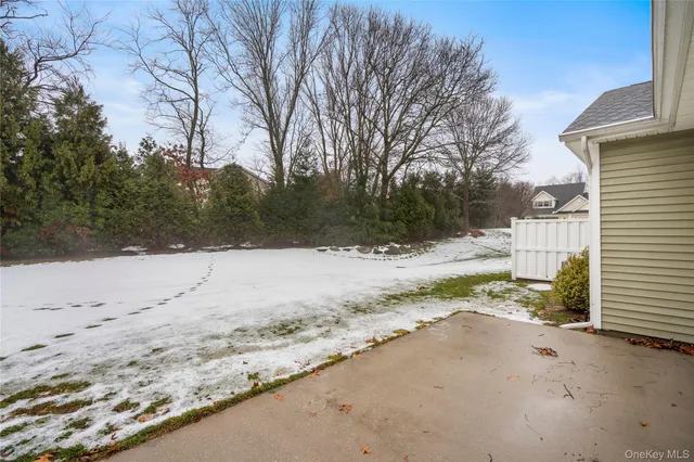 a view of a yard covered in snow