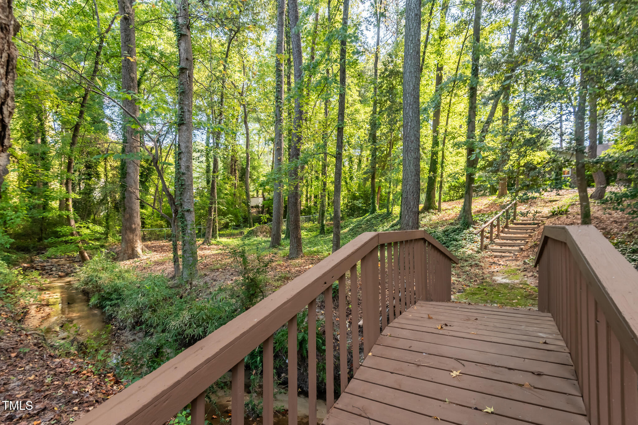 3410 Oates Drive Raleigh, NC 27604 - Photo 1 of 5 a balcony with trees in front of it