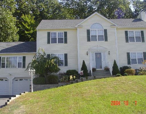 102 Lazy Brook Road Monroe, CT 06468 - Photo 1 of 1 a front view of a house with a yard