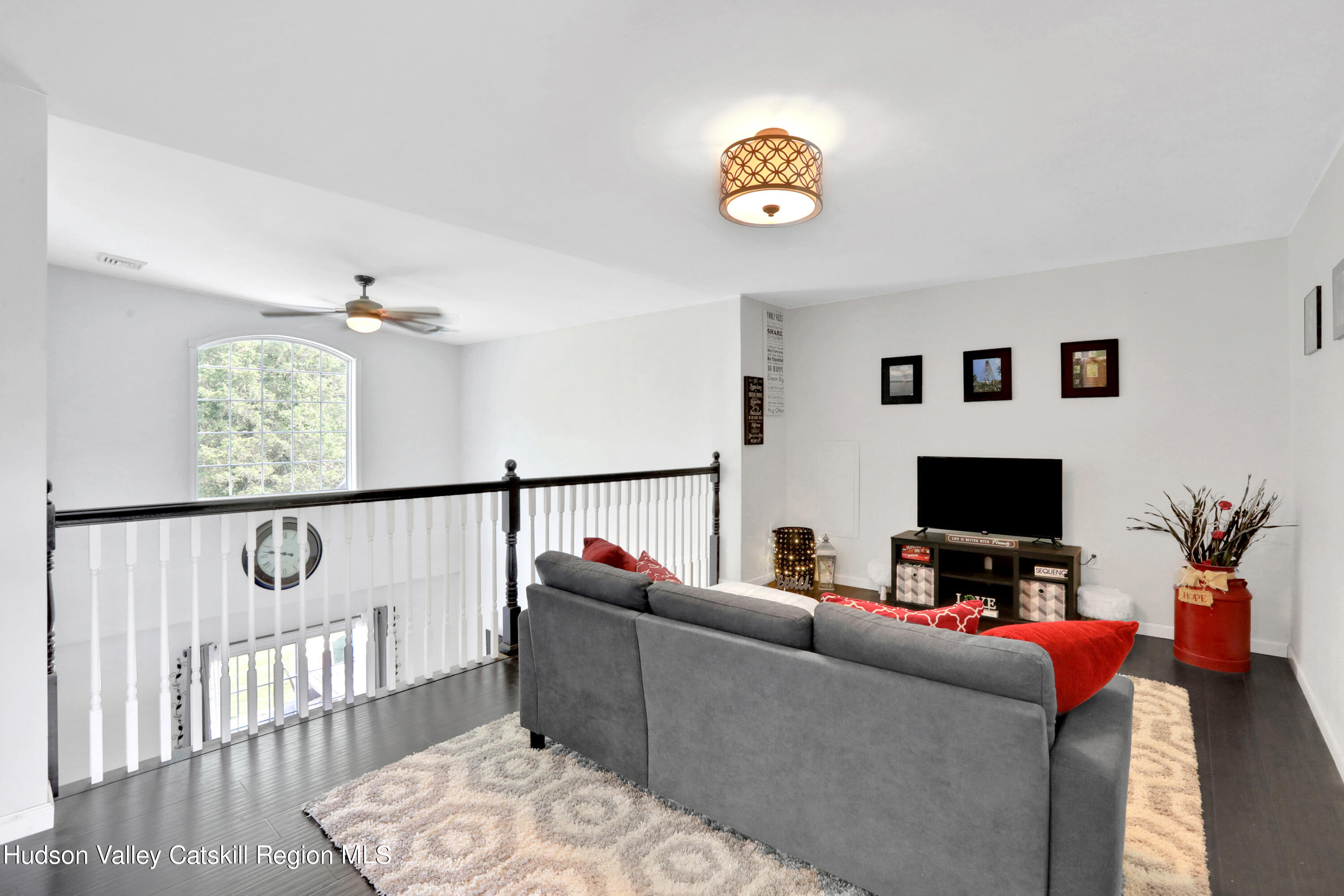 187 Russell Road Hurley, NY 12443 - Photo 22 of 33 a living room with furniture and a flat screen tv
