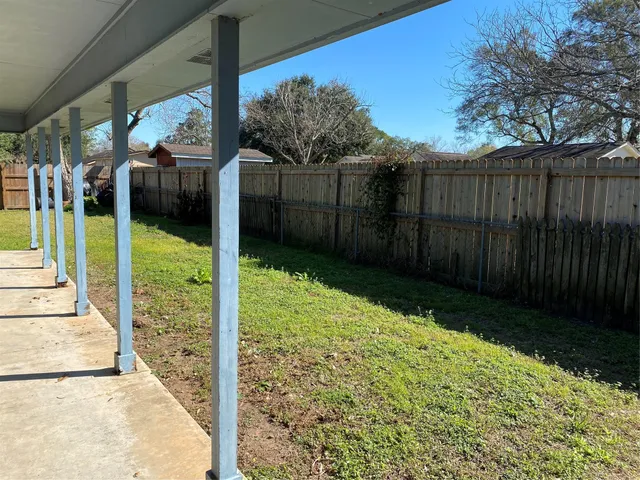 a view of backyard with tub