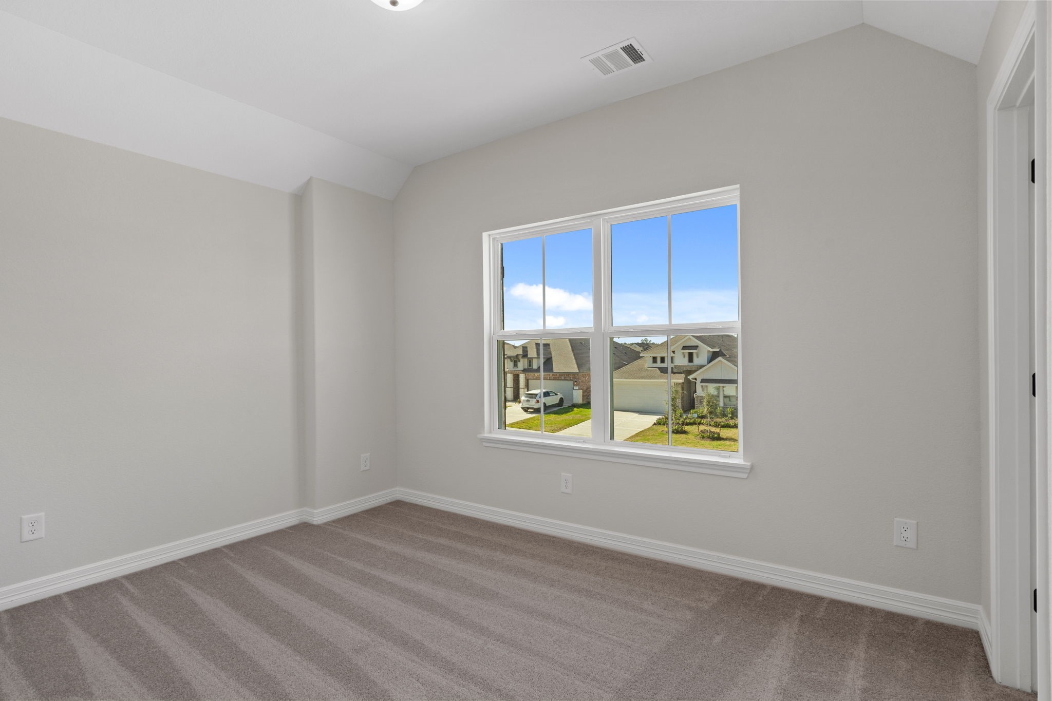 32414 Poplar Grove Lane Conroe, TX 77385 - Photo 17 of 30 Your secondary bedroom features plush carpet, fresh paint, closet, and a large window that lets in plenty of natural lighting.