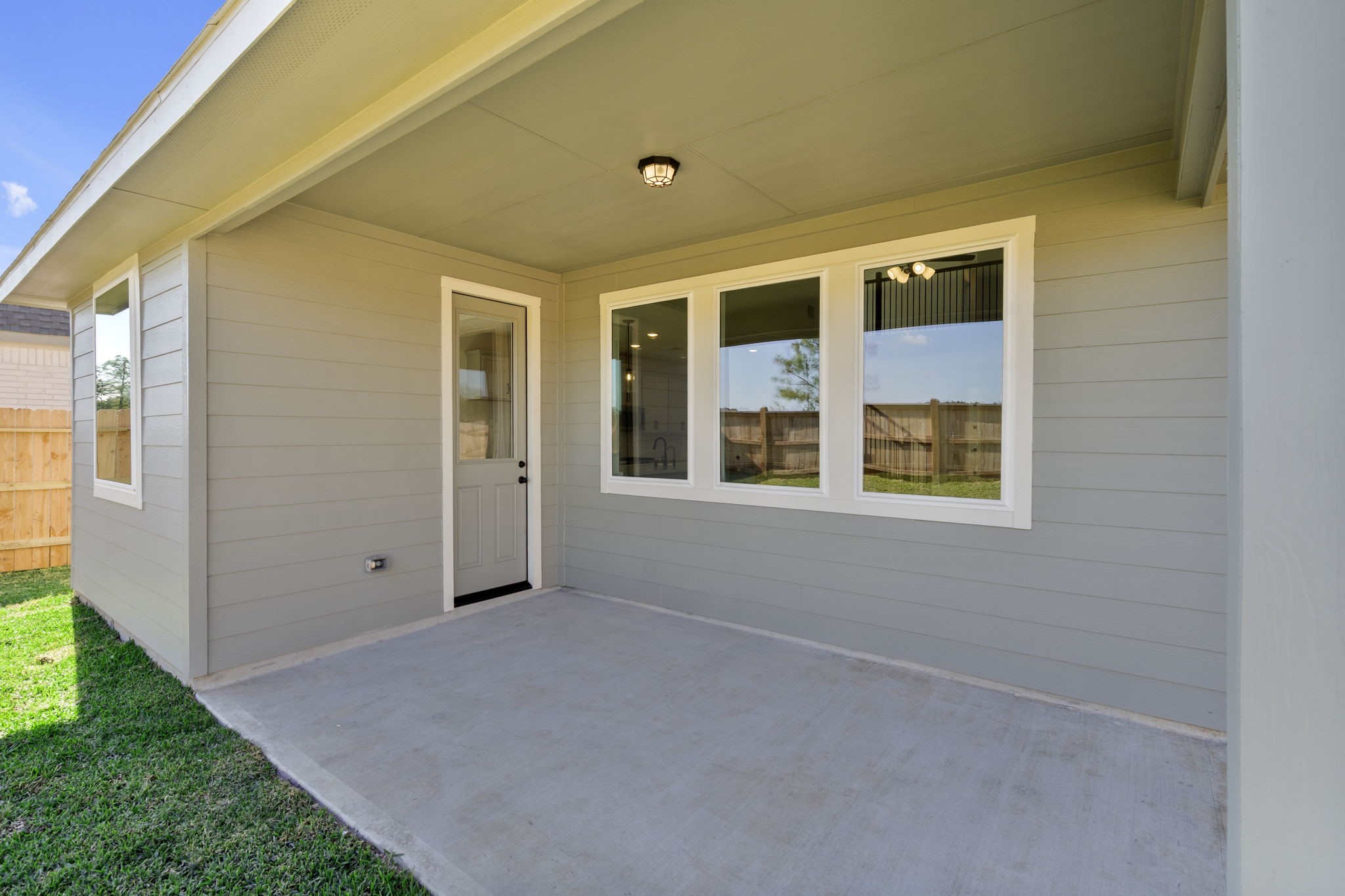 32414 Poplar Grove Lane Conroe, TX 77385 - Photo 23 of 30 The covered patio is generously sized, providing ample space for various outdoor activities.