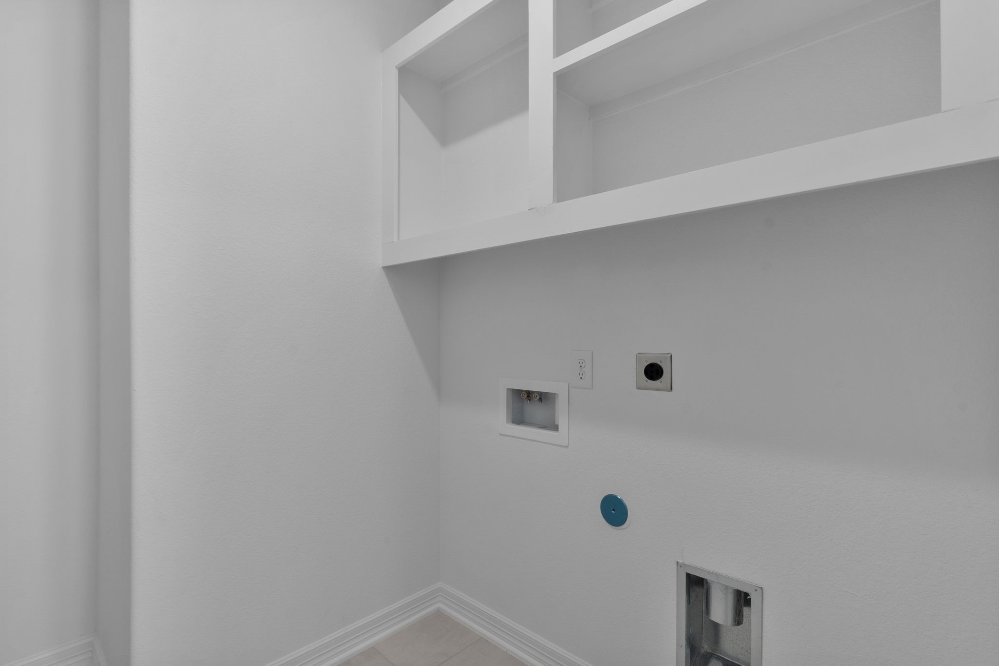 32414 Poplar Grove Lane Conroe, TX 77385 - Photo 7 of 30 The laundry room layout is carefully planned for optimal workflow with designated areas for washing, drying, and storing.