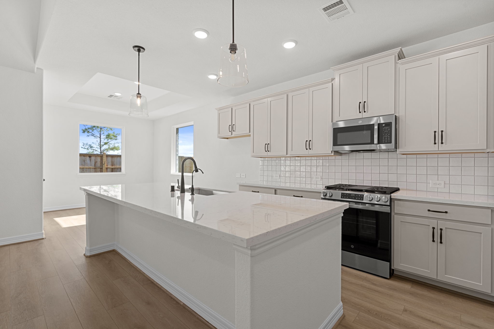 32414 Poplar Grove Lane Conroe, TX 77385 - Photo 10 of 30 This kitchen is not only a functional space but also has ample storage. Whether you're a seasoned chef or just love to gather and enjoy good food, this kitchen is a dream come true.