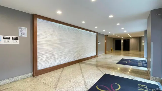 a view of hallway with a large window