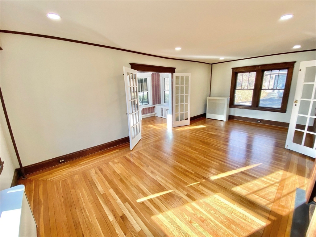 42 Amherst Road South Hadley, MA 01075 - Photo 11 of 28 a view of empty room with wooden floor and fan