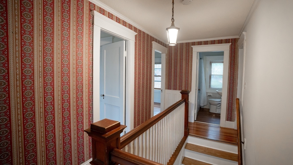 42 Amherst Road South Hadley, MA 01075 - Photo 13 of 28 a view of a hallway with wooden floor and stairs