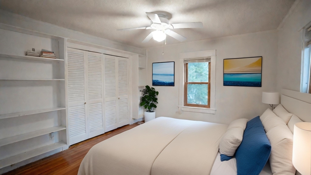 42 Amherst Road South Hadley, MA 01075 - Photo 17 of 28 a bedroom with a large bed and a chandelier