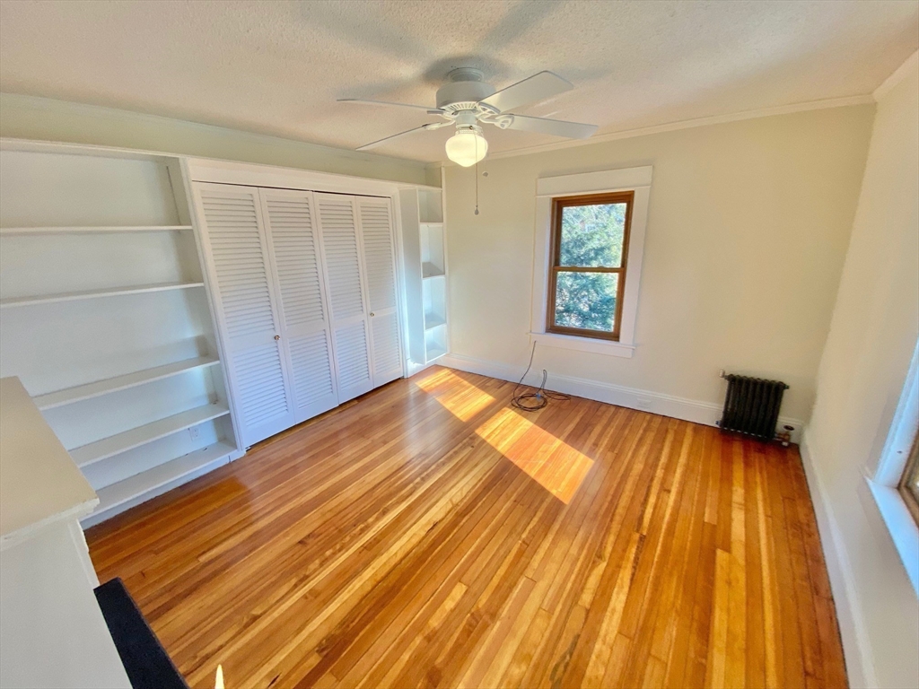 42 Amherst Road South Hadley, MA 01075 - Photo 19 of 28 a view of an empty room with wooden floor and a window